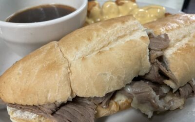 The making of the 1860s Garlic Cheese Bread Roast Beef Sandwich